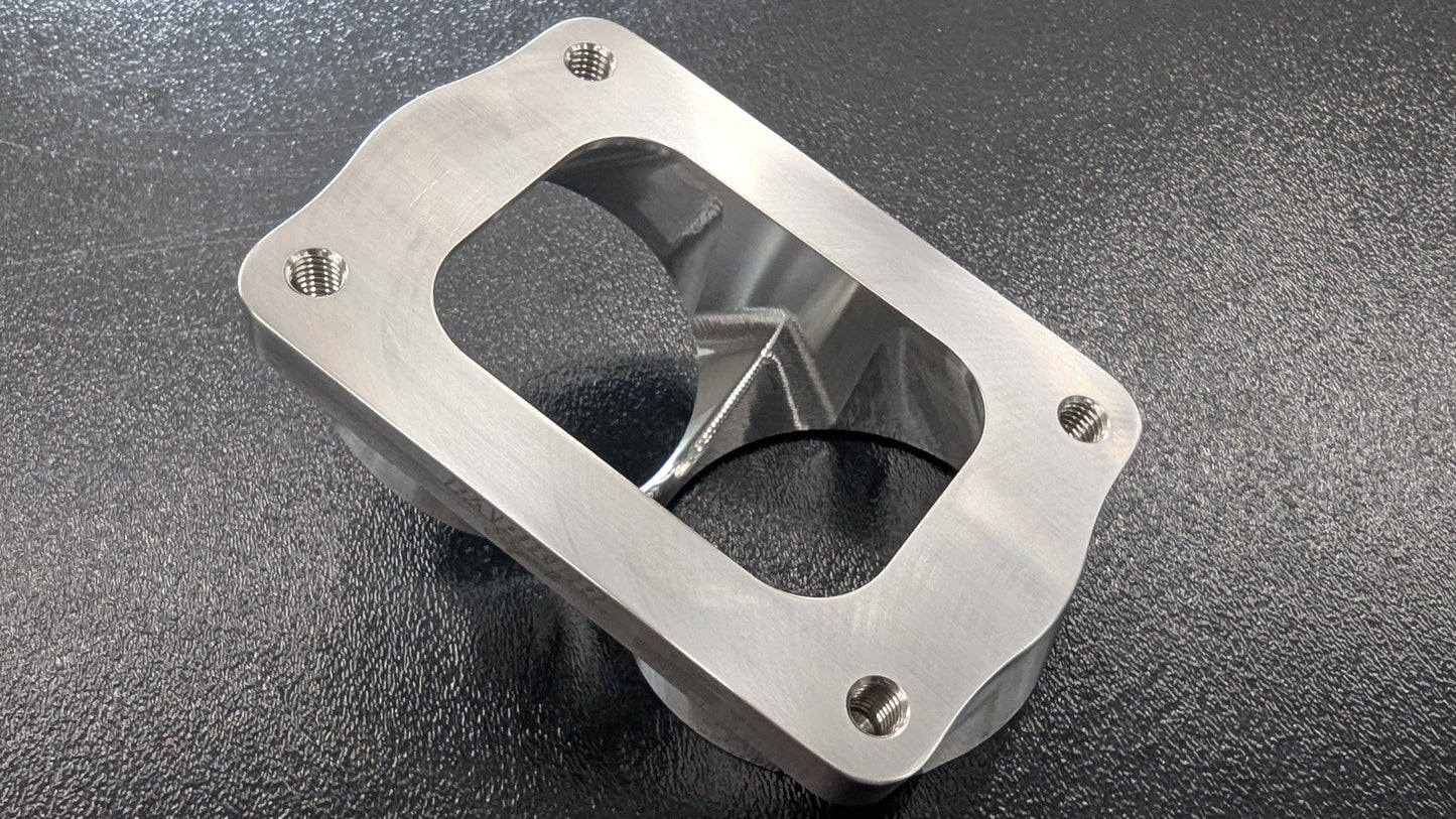 Parker Speed T6 Dual 3 inch canted turbo flange bottom view showing CNC machined dual exhaust ports and mounting holes