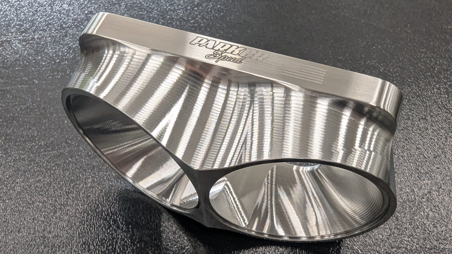 Parker Speed T6 Dual 3 inch canted turbo flange side view showing precision machined dual ports and smooth exhaust transition